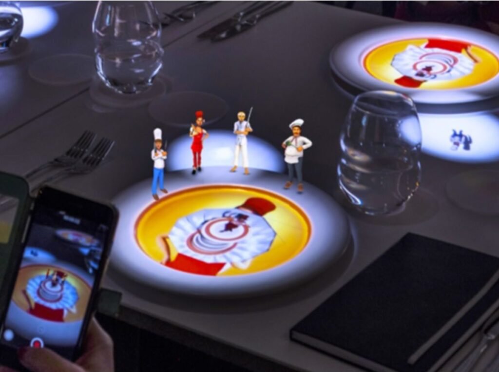 Le Petit Chef no Canopy by Hilton, São Paulo, mostrando um jantar imersivo com projeções em 3D
